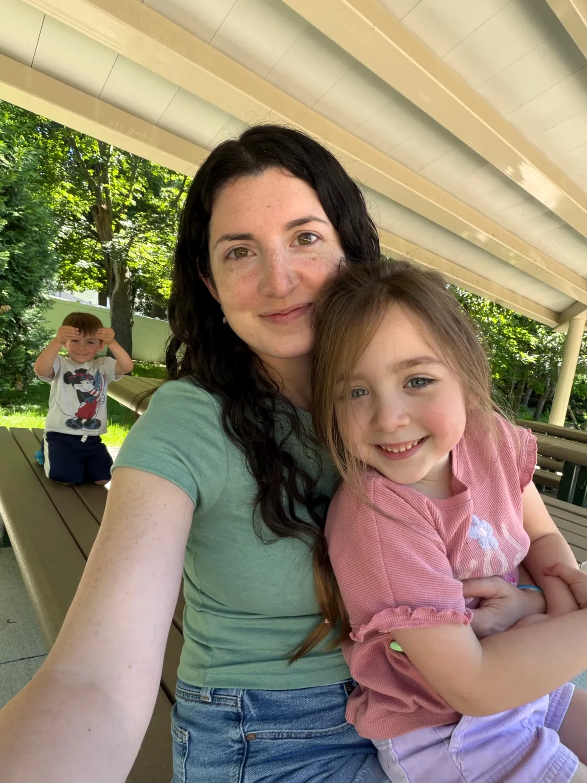 Bethany Barba hugging her daughter outdoors
